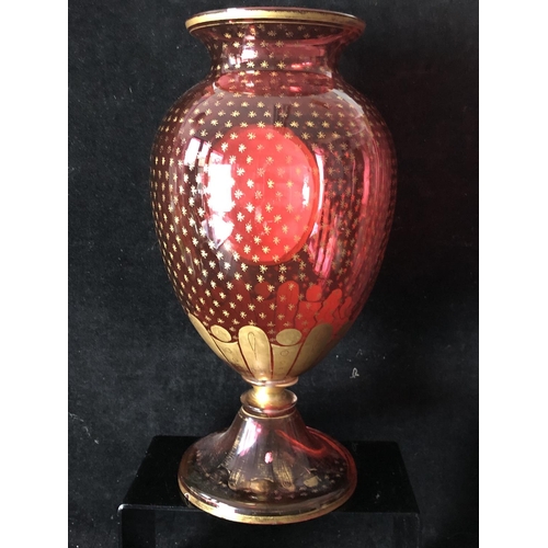 139 - Bohemian Glass - an overlay glass vase, the ovoid body of ruby overlaid in white and cut through wit... 