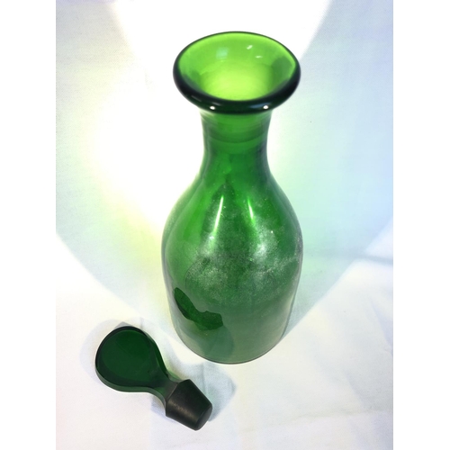 217 - English Glass - an emerald green glass mallet form decanter with flat teardrop stopper, 33cm high (2... 