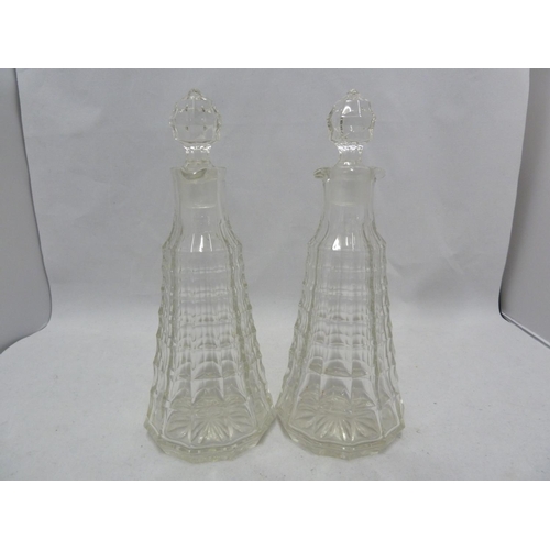 216 - Clayton Mayers - a pair of pressed glass Jacobean pattern cruet bottles and stoppers, 22.5cm high; a... 