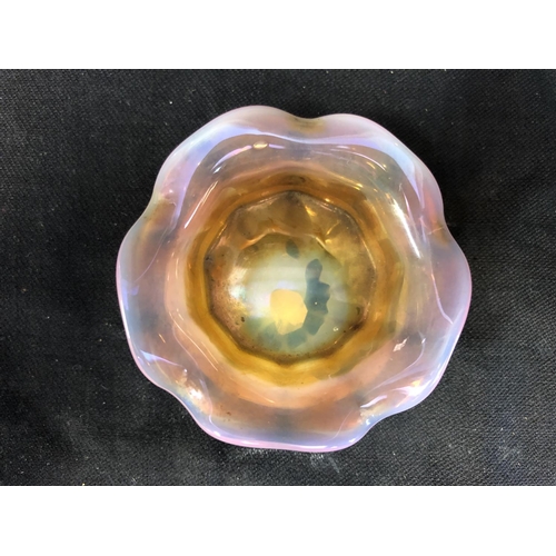 186 - Cristallerie de Pantin - an iridescent opaline glass salt, pink/orange colouration, circular with wa... 