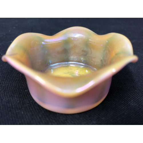 185 - Cristallerie de Pantin - an iridescent opaline glass salt, pink/orange colouration, circular with wa... 