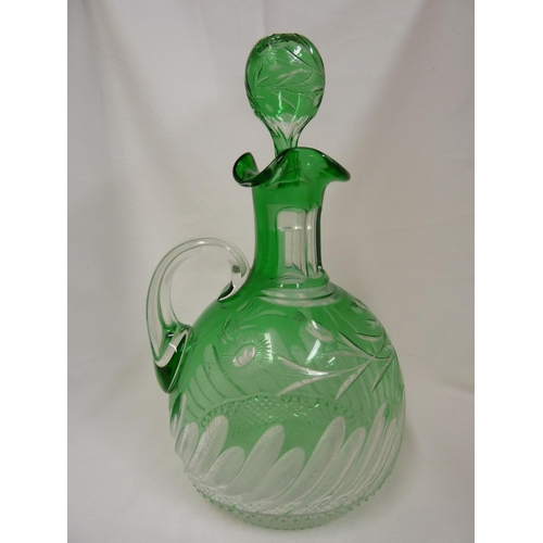 245 - Stevens and Williams - a glass Whisky decanter and stopper, the green casing cut through to clear wi... 