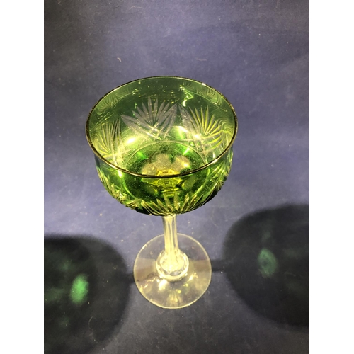 115 - Continental Glass - Two two colour overlay hock glasses, the bowls of green; and amethyst over yello... 