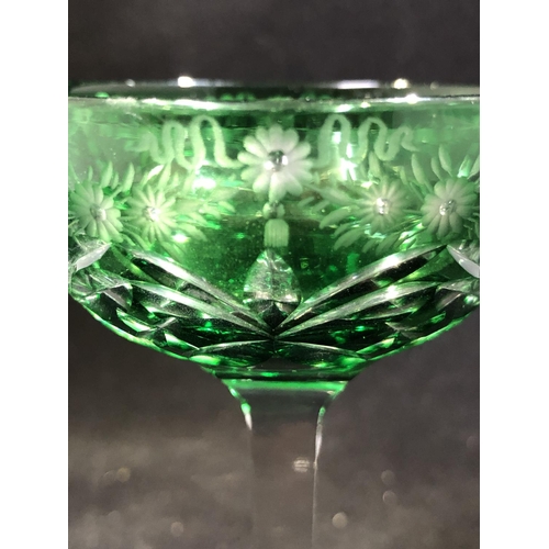 247 - Stevens and Williams - a pair of green overlay glass cocktail coupes, the green bowls cut through to... 