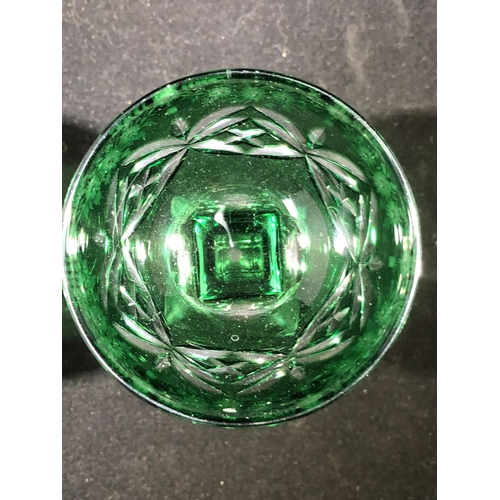 247 - Stevens and Williams - a pair of green overlay glass cocktail coupes, the green bowls cut through to... 