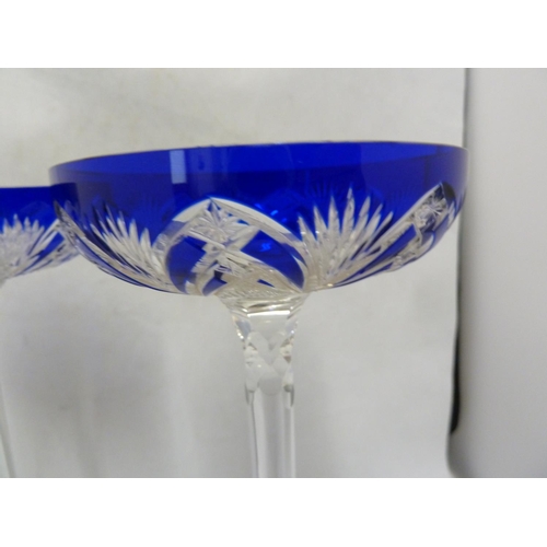 118 - Baccarat - a pair of Tzar Champagne coups, the bowls cased in cobalt blue and cut with a stylised Lo... 