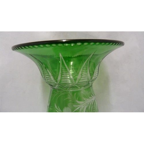 243 - Stevens & Williams - an intaglio cut cased glass vase of unusual shape, the tapered ovoid body suppo... 