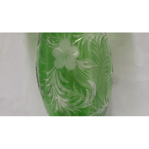 243 - Stevens & Williams - an intaglio cut cased glass vase of unusual shape, the tapered ovoid body suppo... 