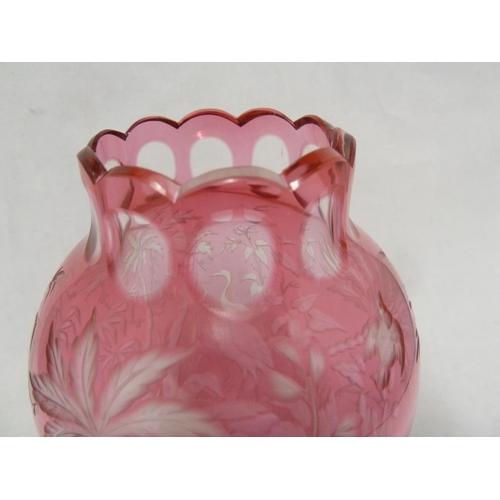 119 - French Glass, possibly Baccarat, an intaglio cut vase of pale cranberry cut to colourless with crane... 