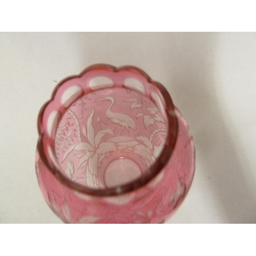 119 - French Glass, possibly Baccarat, an intaglio cut vase of pale cranberry cut to colourless with crane... 