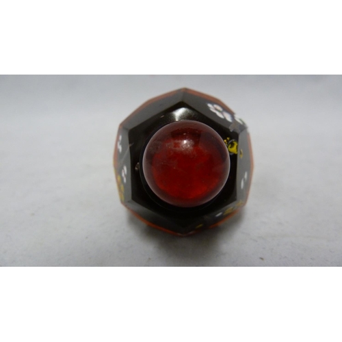 95 - Chinese Glass - a deep amber glass faceted snuff bottle enamelled in polychrome colours with prunus ... 