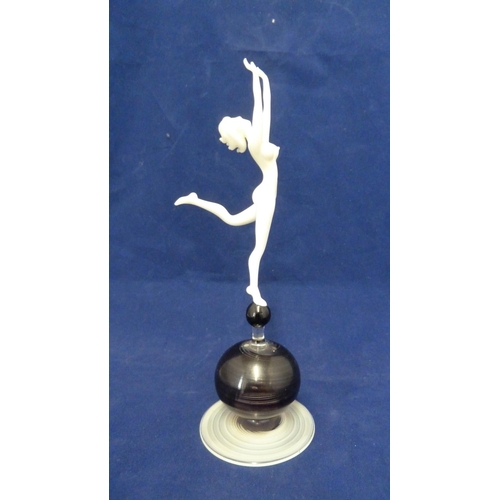 86 - Istvan Komaromy - a glass dancer figure, the white nude dancer upon a spiral striated ball and sprea... 