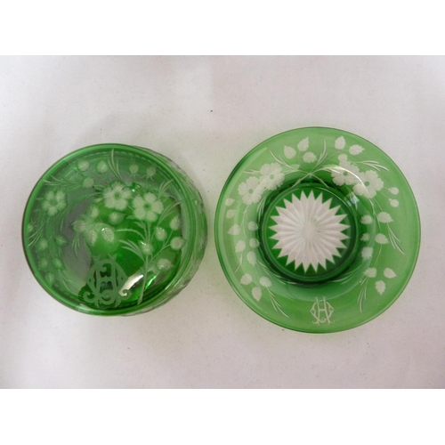 255 - Stevens and Williams - an intaglio cut glass powder bowl cover and underdish, of green cut through t... 