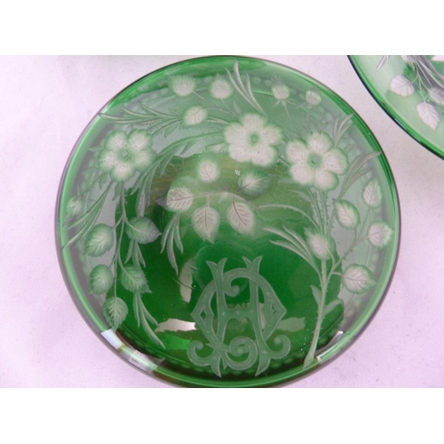 255 - Stevens and Williams - an intaglio cut glass powder bowl cover and underdish, of green cut through t... 