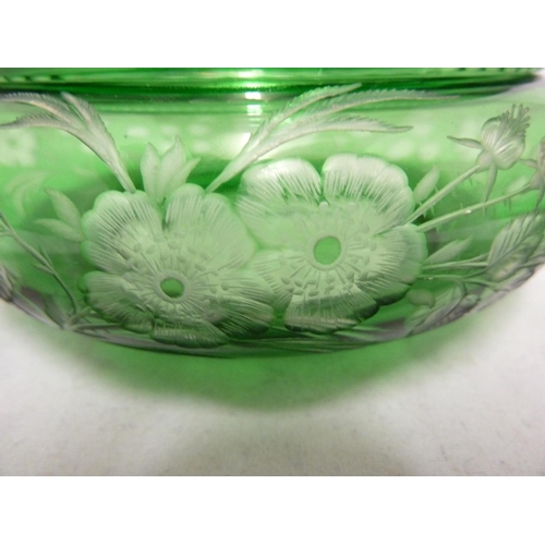 255 - Stevens and Williams - an intaglio cut glass powder bowl cover and underdish, of green cut through t... 