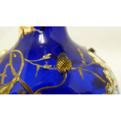 176 - Moser - a cobalt blue bottle vase, enamelled and gilded with oak leaves and branches with applied si... 