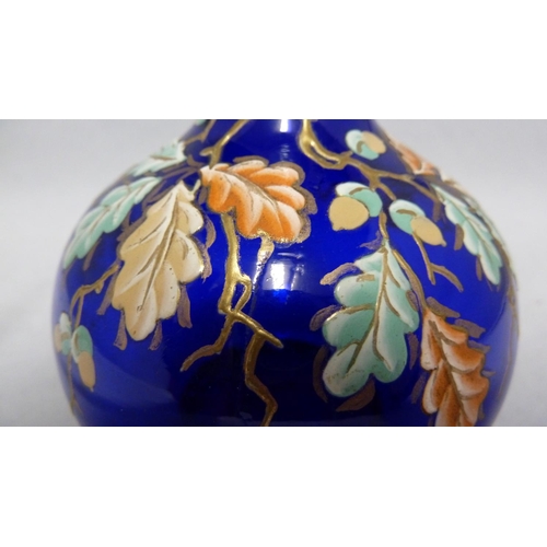 177 - Moser - a cobalt blue bottle vase, enamelled and gilded with oak leaves and branches and acorns,  18... 