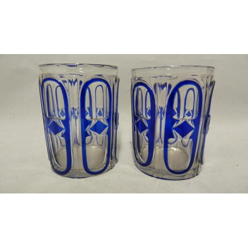 137 - Continental Glass, possibly Russian - two blue cased glass beakers the overlay cut through to colour... 