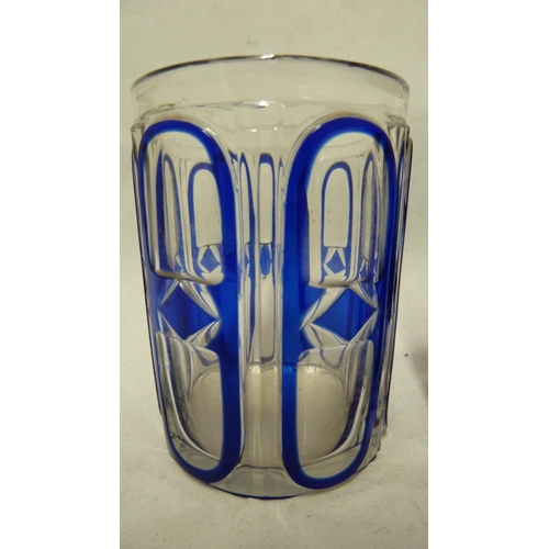 137 - Continental Glass, possibly Russian - two blue cased glass beakers the overlay cut through to colour... 