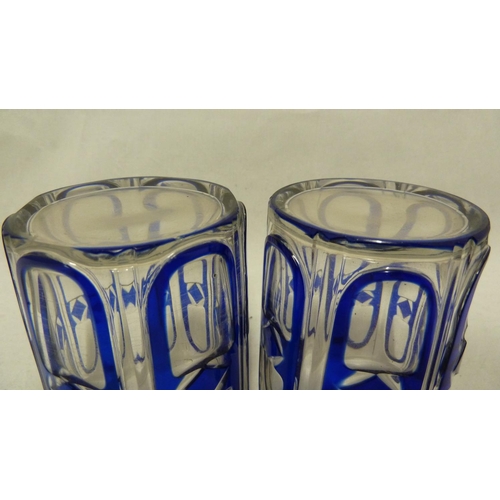 137 - Continental Glass, possibly Russian - two blue cased glass beakers the overlay cut through to colour... 