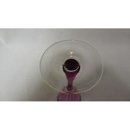 249 - Stevens & Williams - a rose coloured wine glass, of conical bowl, cut with fluting, star and fan mot... 