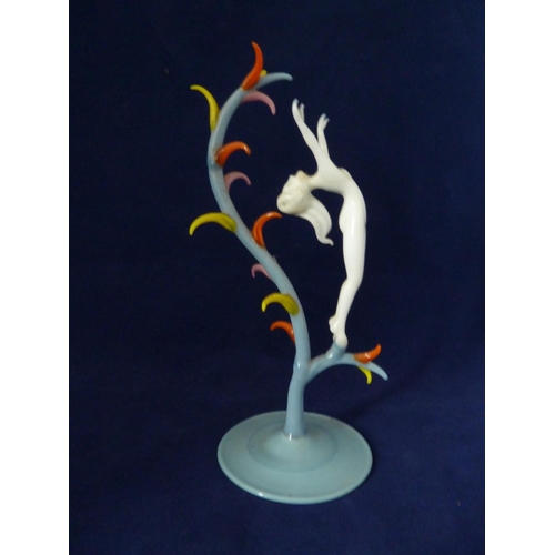 85 - Bimini - a lampwork glass figure of Spring, she of white glass posed arched backwards with arms upra... 