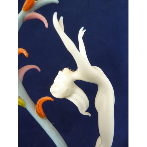 85 - Bimini - a lampwork glass figure of Spring, she of white glass posed arched backwards with arms upra... 