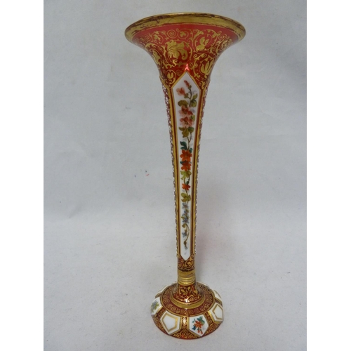 138 - Bohemian Glass - a cased glass solifleur vase, of trumpet form, the white overlay cut through to rub... 