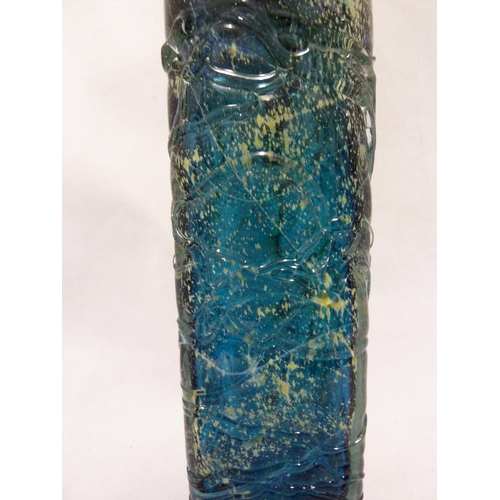 22 - Mdina glass - a large attenuated bottle with random strapping, of amethyst, blue and sand colouratio... 