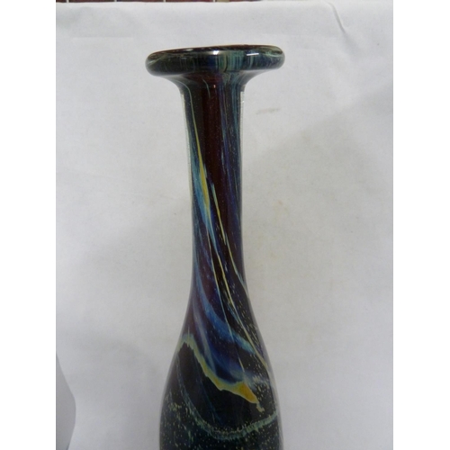 22 - Mdina glass - a large attenuated bottle with random strapping, of amethyst, blue and sand colouratio... 