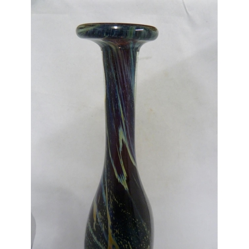 22 - Mdina glass - a large attenuated bottle with random strapping, of amethyst, blue and sand colouratio... 