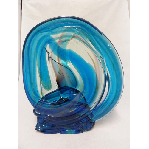 23 - Mdina glass - a knot sculpture, in predominantly blue colour, marked to base Mdina Glass, dated 1975... 