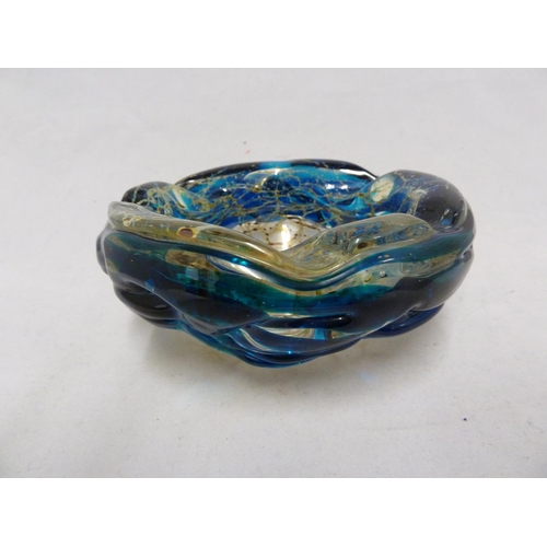 26 - Mdina glass - a bowl with everted rim, the textured blue glass rim folded over a sand and rust strea... 