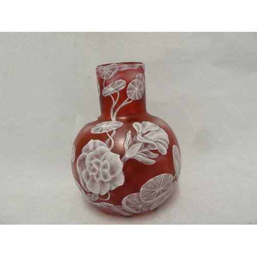 240 - English Cameo Glass - a squat bottle form vase of white cameo cut through to raspberry pink with a d... 