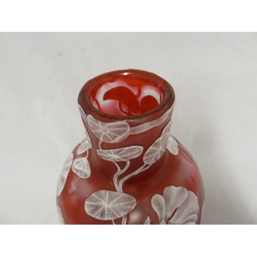 240 - English Cameo Glass - a squat bottle form vase of white cameo cut through to raspberry pink with a d... 