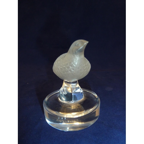 109 - Lalique - a Perdrix / Partridge bird glass paperweight the frosted glass bird standing a top a colou... 