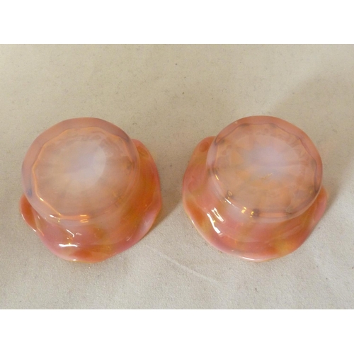 187 - Cristallerie de Pantin - two iridescent opaline glass salts of pink/orange colouration, circular wit... 