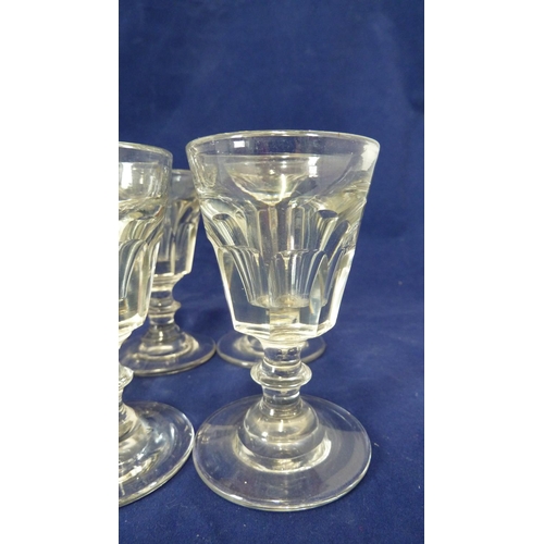 210 - English glass - a set of six deceptive toasting glasses, the octagonal facetted bowl on short stem w... 