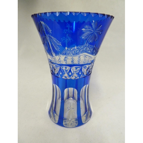 250 - Stevens & Williams - a blue cased glass vase, of waisted cylindrical form the cobalt blue cut throug... 