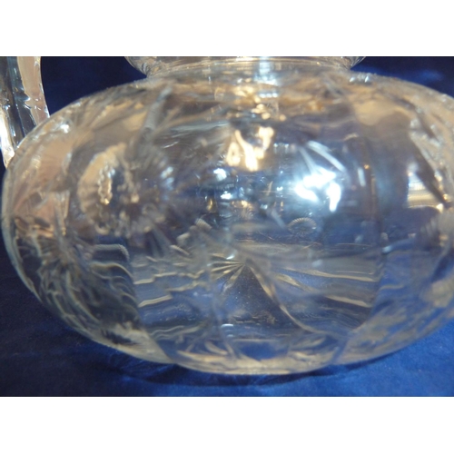 259 - Stevens & Williams - a Rock Crystal two handled vase, the flattened globular body cut with floral sp... 