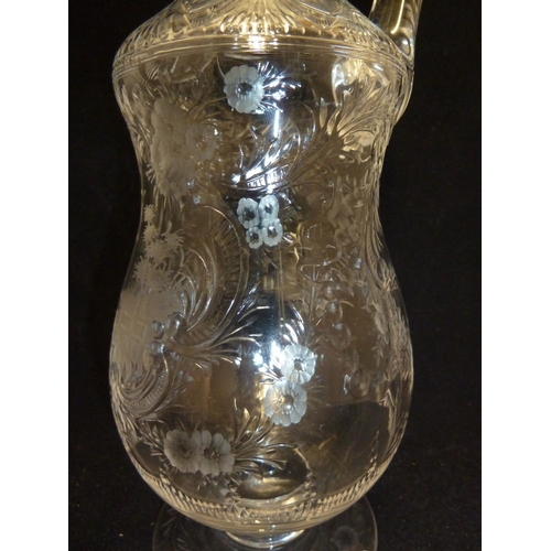 258 - Stevens & Williams - a Rock Crystal glass claret jug and stopper, the pear form body with high loope... 