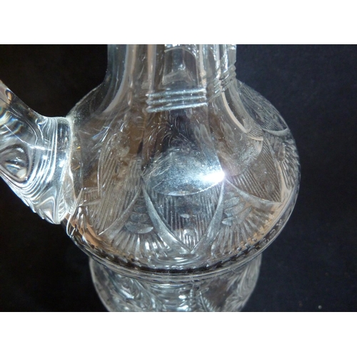 258 - Stevens & Williams - a Rock Crystal glass claret jug and stopper, the pear form body with high loope... 