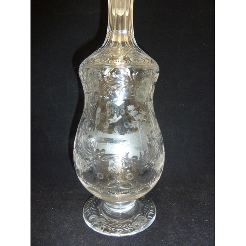 258 - Stevens & Williams - a Rock Crystal glass claret jug and stopper, the pear form body with high loope... 