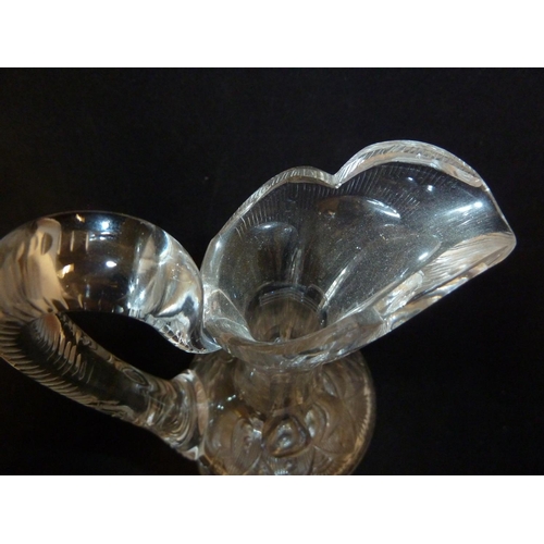 258 - Stevens & Williams - a Rock Crystal glass claret jug and stopper, the pear form body with high loope... 