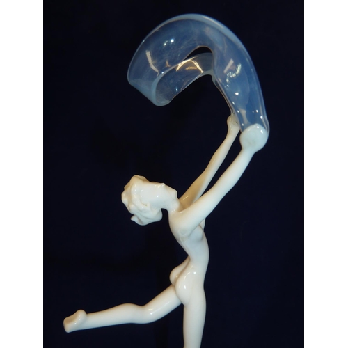 87 - Istvan Komaromy - A Banner Dancer glass figure, the naked female figure with pale blue arched banner... 