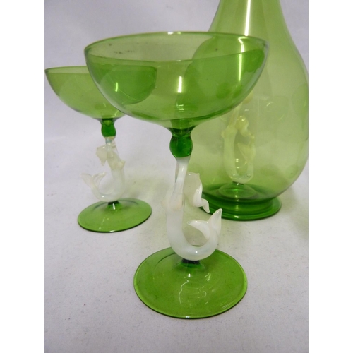 92 - Bimini - a Mermaid glass decanter and four cocktail glasses, the green decanter enclosing the white ... 