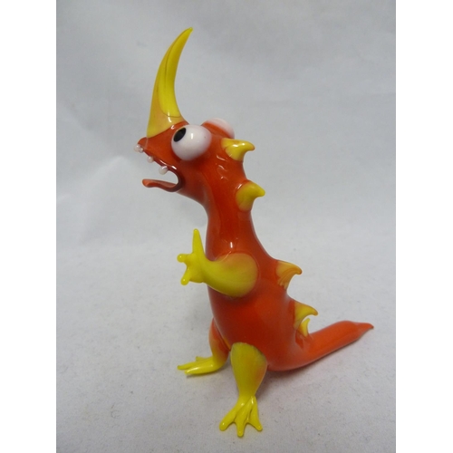 79 - Czechoslovakian Glass - a lamp blown figure of a dinosaur, brightly coloured polychrome glass, 10.5c... 