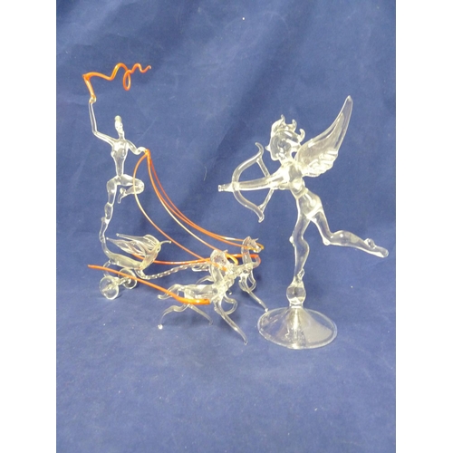 84 - Lamp work figures - a lady charioteer with horses, in colourless glass with orange glass details; an... 