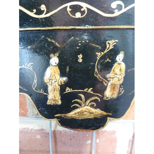 138 - A Chinoiserie black japanned framed looking glass, decorated with gilded raised figures in a landsca... 