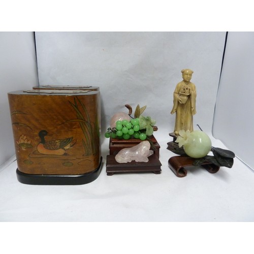 112 - A Chinese soapstone figure of an immortal holding a pot plant; various glass and stone models of fru... 